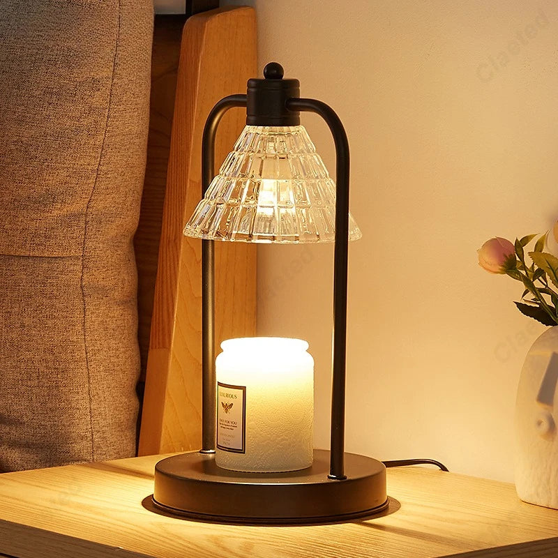 Decorative wax melt warmer lamp glowing softly on a bedside table